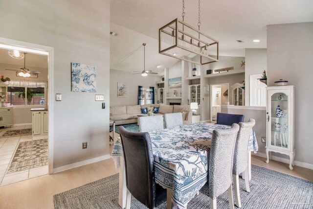 905 Shadow Ridge Dr, Pensacola, FL 32514 - dining space featuring ceiling fan, baseboards, high vaulted ceiling, wood finished floors, and recessed lighting