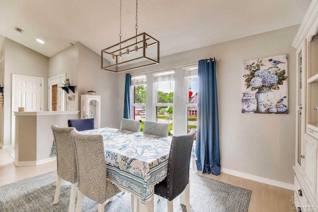 905 Shadow Ridge Dr, Pensacola, FL 32514 - dining space with baseboards, wood finished floors, recessed lighting, and a chandelier