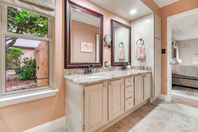 905 Shadow Ridge Dr, Pensacola, FL 32514 - bathroom featuring connected bathroom, double vanity, baseboards, and tile patterned floors