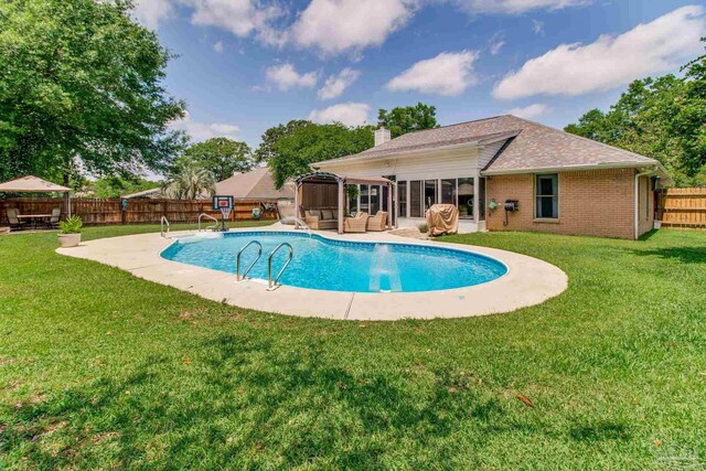 905 Shadow Ridge Dr, Pensacola, FL 32514 - view of swimming pool with a sunroom and a patio