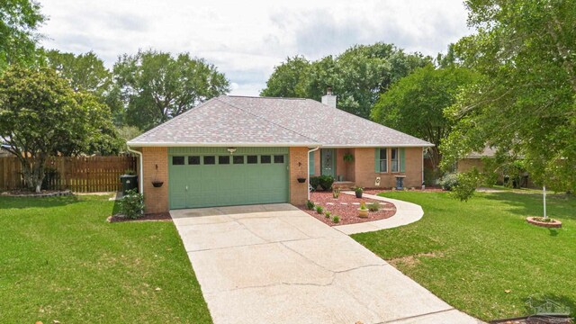 905 Shadow Ridge Dr, Pensacola, FL 32514 - single story home featuring a garage, brick siding, concrete driveway, a chimney, and a shingled roof