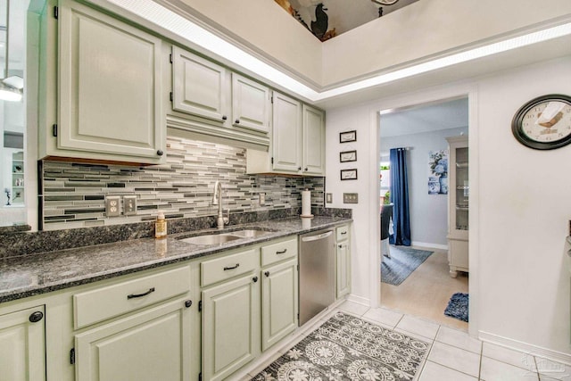 905 Shadow Ridge Dr, Pensacola, FL 32514 - kitchen with a sink, dishwasher, backsplash, light tile patterned floors, and dark stone countertops