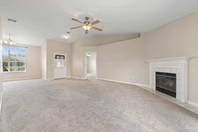 1978 Coral Reef Rd, Pensacola, FL 32506 - unfurnished living room featuring carpet, vaulted ceiling, a ceiling fan, a tiled fireplace, and baseboards