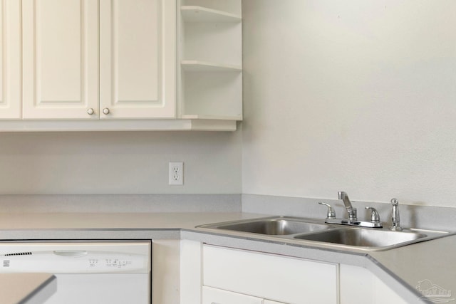 1978 Coral Reef Rd, Pensacola, FL 32506 - kitchen featuring dishwasher, a sink, light countertops, and white cabinets