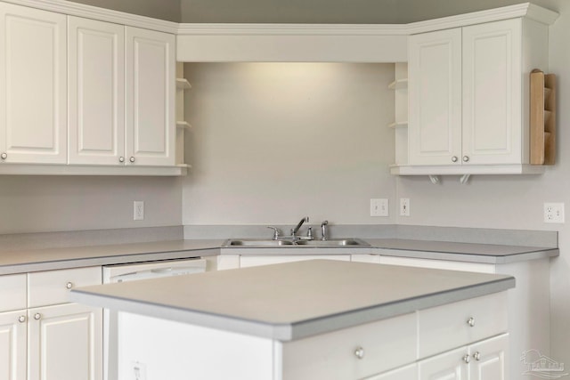 1978 Coral Reef Rd, Pensacola, FL 32506 - kitchen with open shelves, a sink, and white cabinets