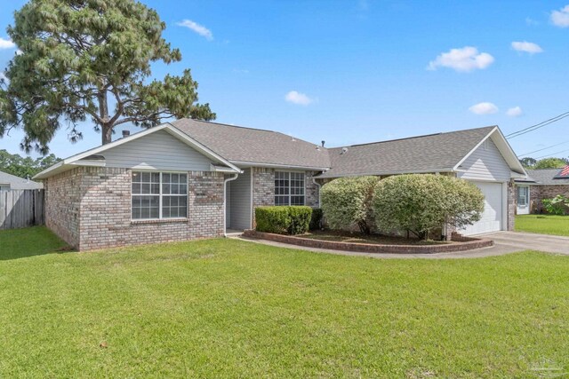 1978 Coral Reef Rd, Pensacola, FL 32506 - ranch-style house with an attached garage, brick siding, driveway, and a shingled roof