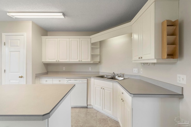 1978 Coral Reef Rd, Pensacola, FL 32506 - kitchen with white dishwasher, a sink, open shelves, white cabinetry, and a textured ceiling