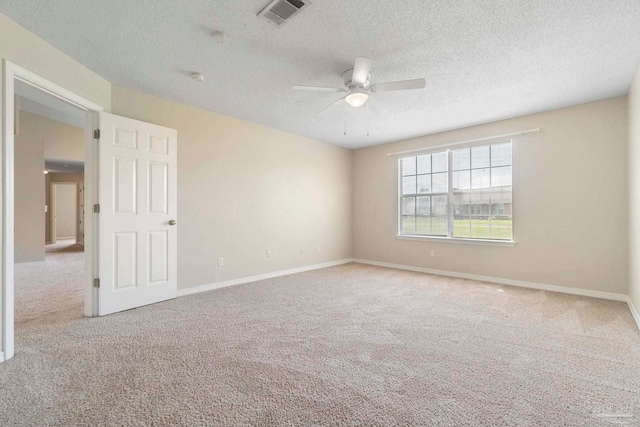 1978 Coral Reef Rd, Pensacola, FL 32506 - carpeted empty room featuring a textured ceiling, a ceiling fan, and baseboards