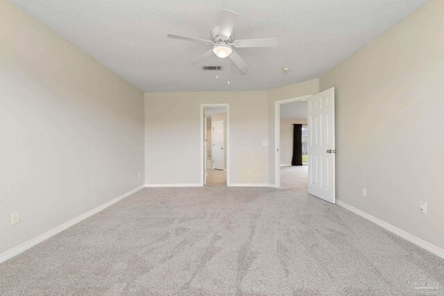 1978 Coral Reef Rd, Pensacola, FL 32506 - unfurnished room with carpet flooring, a ceiling fan, a textured ceiling, and baseboards