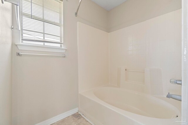 1978 Coral Reef Rd, Pensacola, FL 32506 - bathroom with baseboards, tile patterned floors, and tub / shower combination