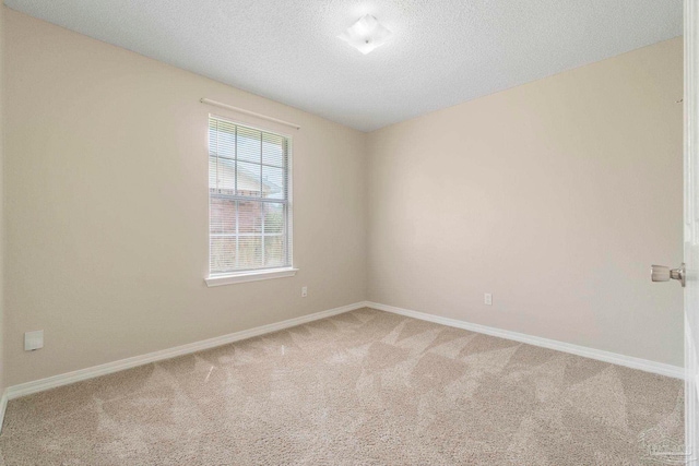 1978 Coral Reef Rd, Pensacola, FL 32506 - carpeted spare room with baseboards and a textured ceiling