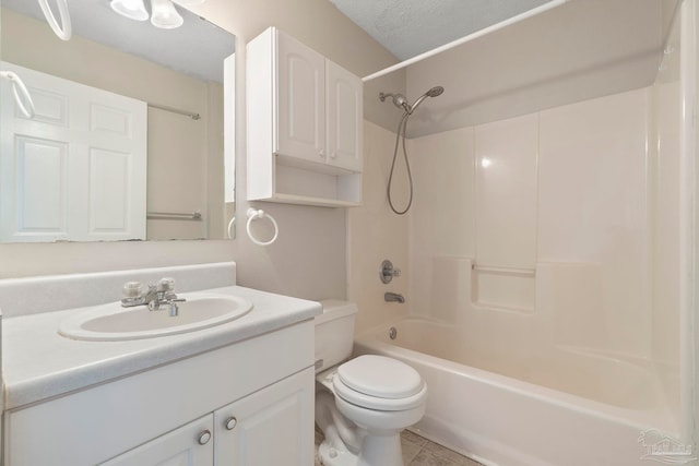 1978 Coral Reef Rd, Pensacola, FL 32506 - full bathroom with toilet, vanity,  shower combination, and a textured ceiling