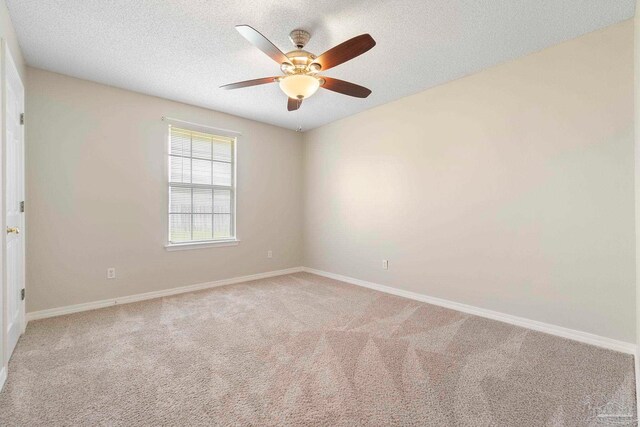 1978 Coral Reef Rd, Pensacola, FL 32506 - carpeted empty room with baseboards, a textured ceiling, and ceiling fan