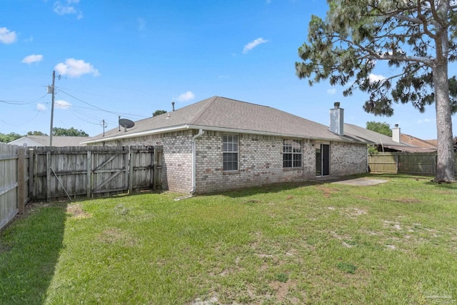 1978 Coral Reef Rd, Pensacola, FL 32506 - back of house with brick siding, a chimney, and roof with shingles