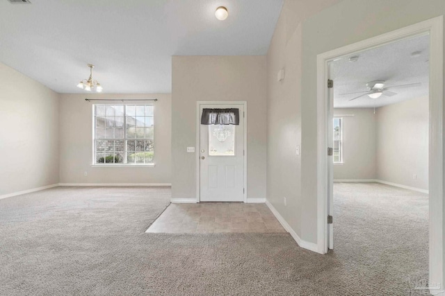 1978 Coral Reef Rd, Pensacola, FL 32506 - carpeted entryway with plenty of natural light, a chandelier, baseboards, and ceiling fan
