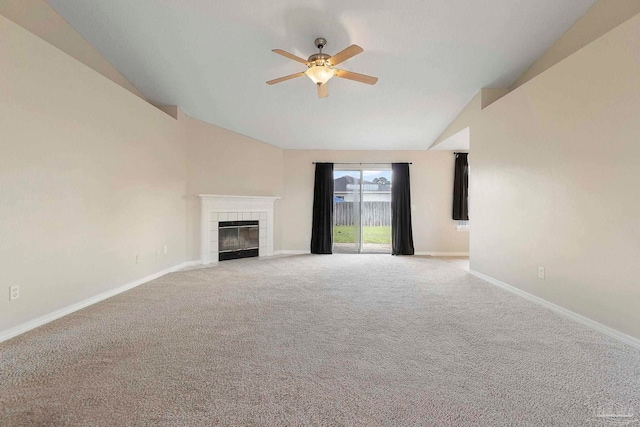 1978 Coral Reef Rd, Pensacola, FL 32506 - unfurnished living room with a ceiling fan, carpet floors, baseboards, a tiled fireplace, and high vaulted ceiling