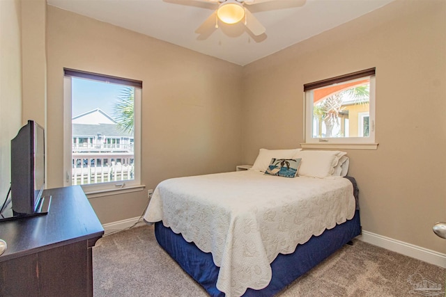 bedroom with carpet, baseboards, and ceiling fan