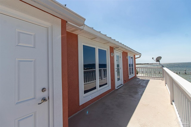 balcony featuring a water view