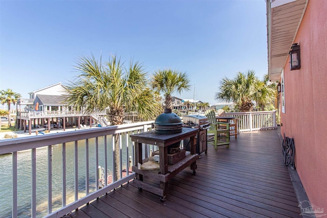 wooden terrace with a water view