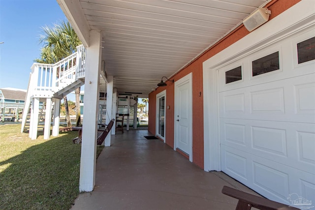 view of patio / terrace featuring a garage