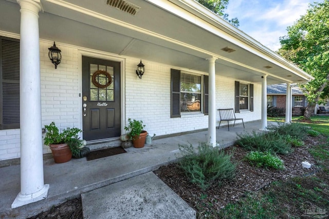 entrance to property with a porch