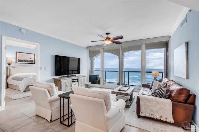 living room featuring a wall of windows, ornamental molding, ceiling fan, and light tile patterned flooring