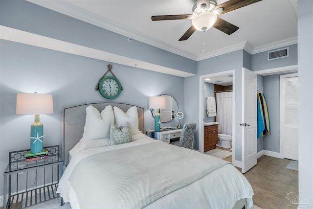 bedroom with ensuite bath, ornamental molding, and ceiling fan