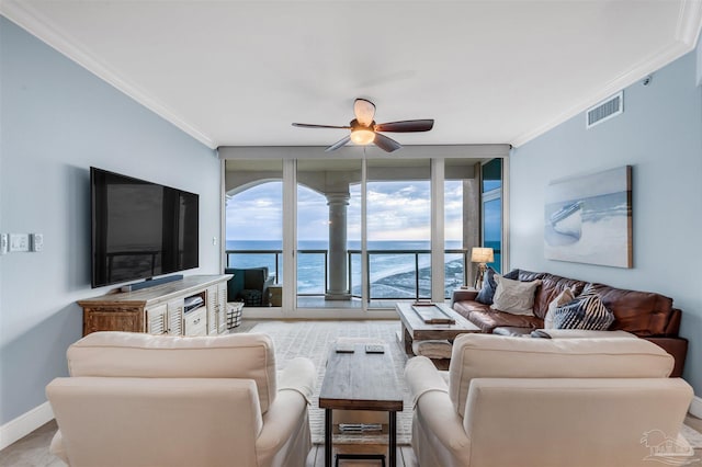 living room with ornamental molding and ceiling fan