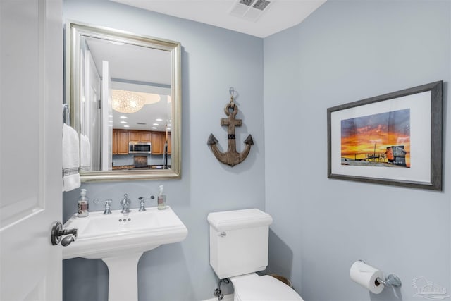 bathroom featuring sink and toilet