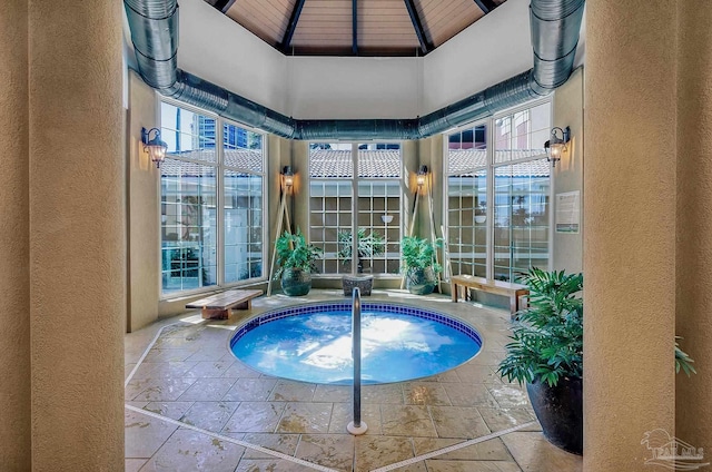 view of pool with a gazebo, an indoor hot tub, and a patio