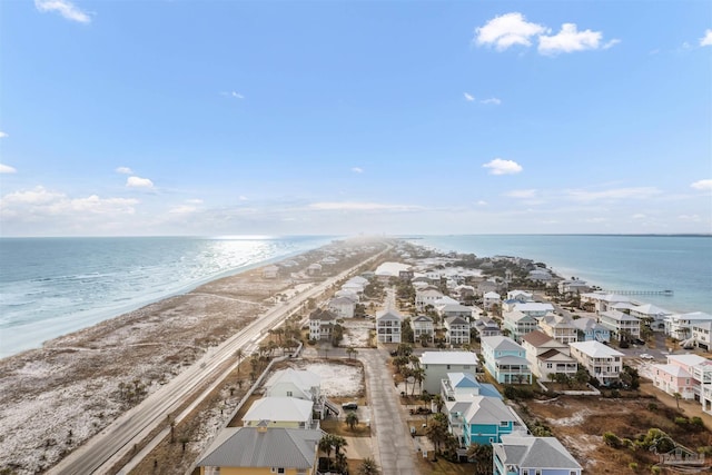 bird's eye view with a view of the beach and a water view