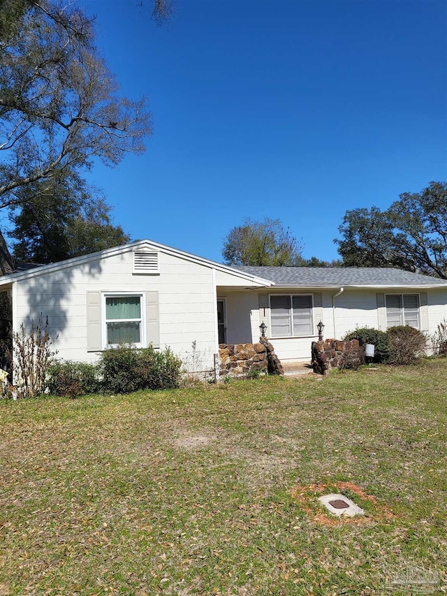 view of home's exterior featuring a lawn