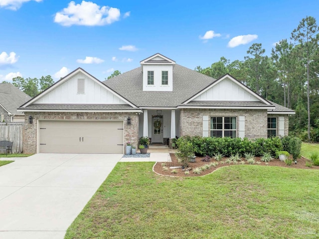 view of front of property featuring a front lawn and a garage