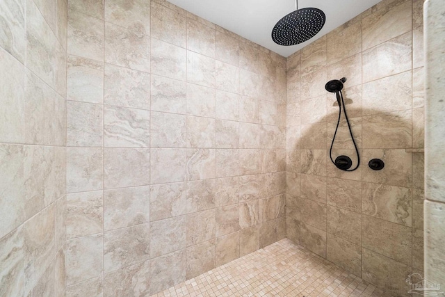 bathroom with a tile shower