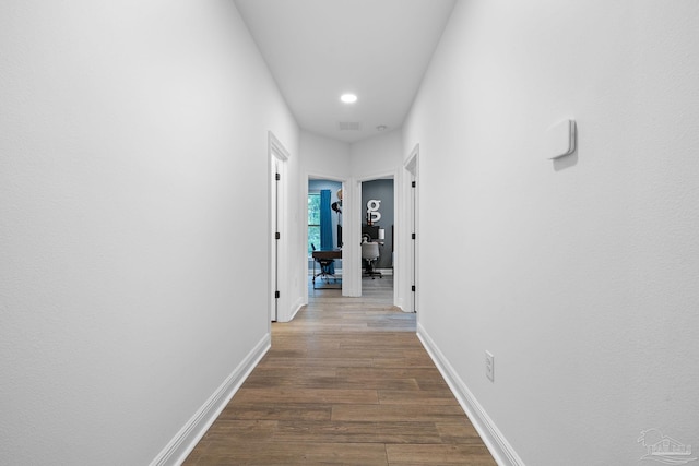 hallway featuring hardwood / wood-style floors