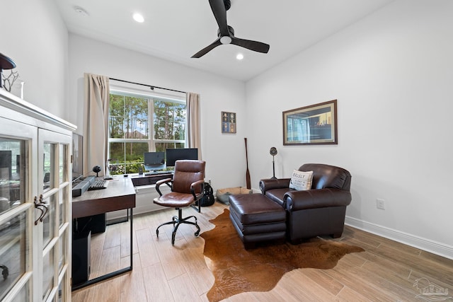 office with ceiling fan and hardwood / wood-style floors