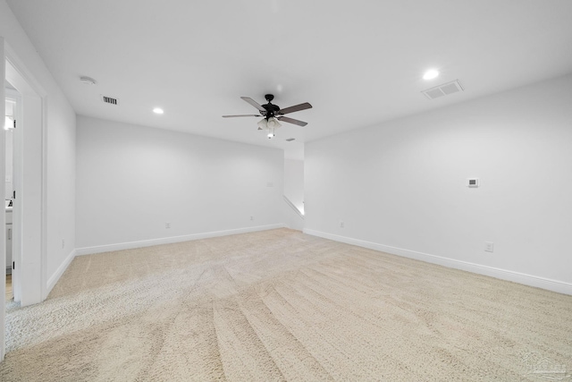 unfurnished room with light carpet and ceiling fan