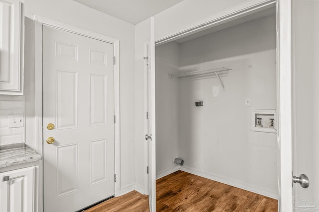 laundry area with hardwood / wood-style floors, electric dryer hookup, and hookup for a washing machine