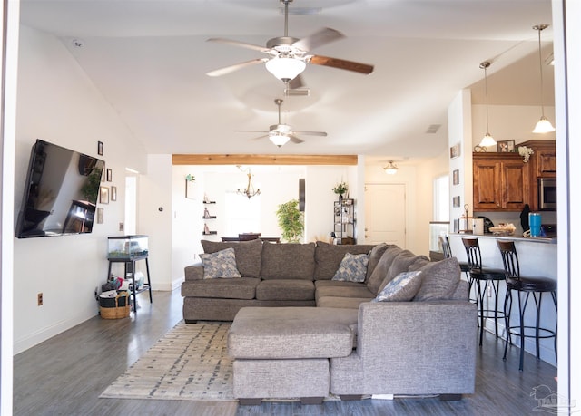 living room featuring vaulted ceiling, dark wood-type flooring, and ceiling fan with notable chandelier