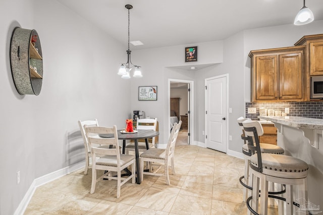 dining room featuring lofted ceiling