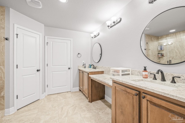 bathroom with vanity and walk in shower