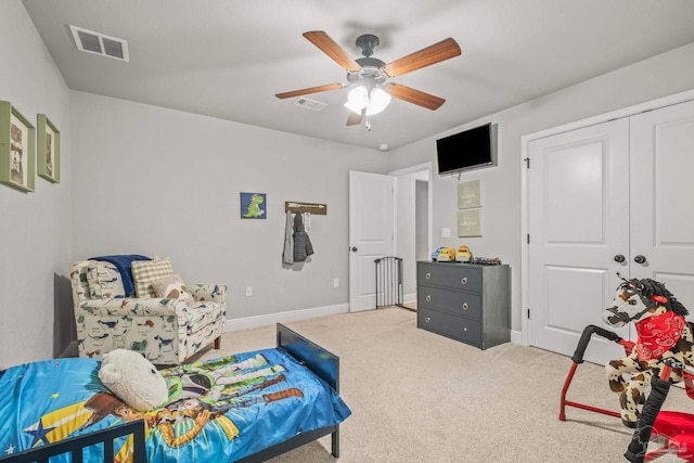 living area with light colored carpet and ceiling fan