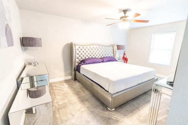 bedroom featuring ceiling fan and light colored carpet