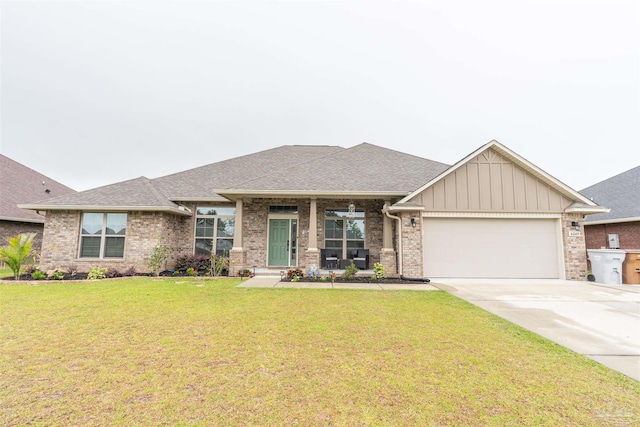 view of front of property with a front yard and a garage