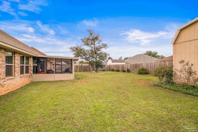 view of yard with a sunroom