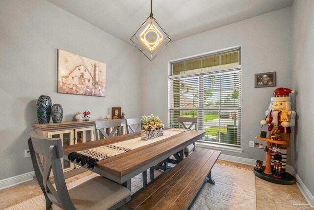 dining room with light tile patterned flooring