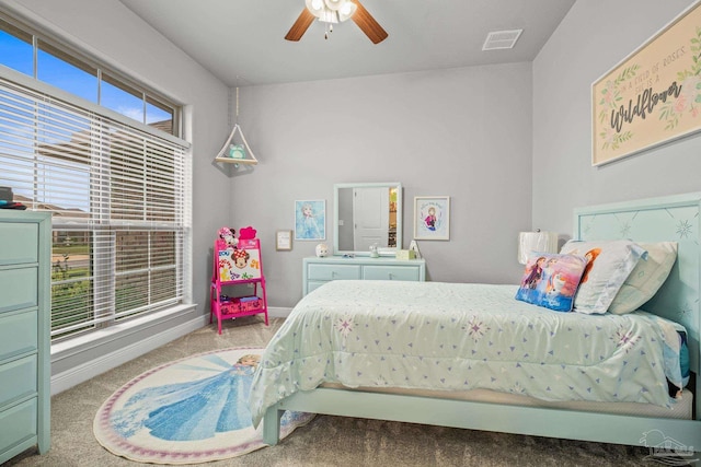 bedroom featuring light colored carpet and ceiling fan