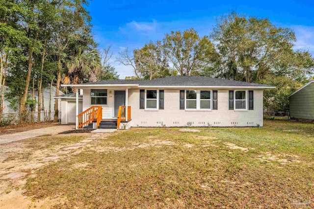 ranch-style house with a front lawn