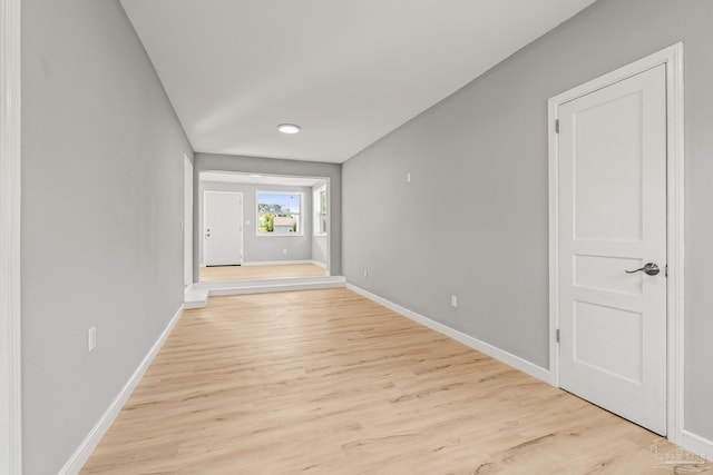 spare room featuring light wood-type flooring