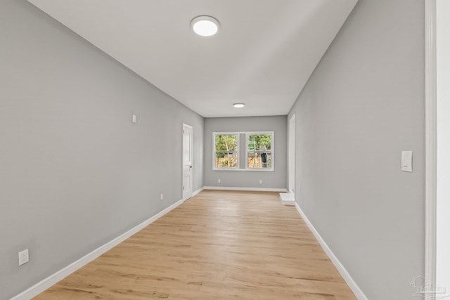 unfurnished room with light wood-type flooring